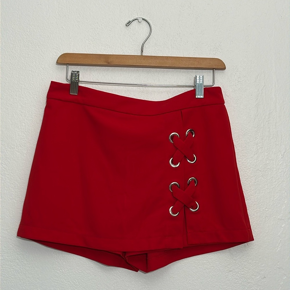 Unique skirt with X-Large  grommet detail in front of slit